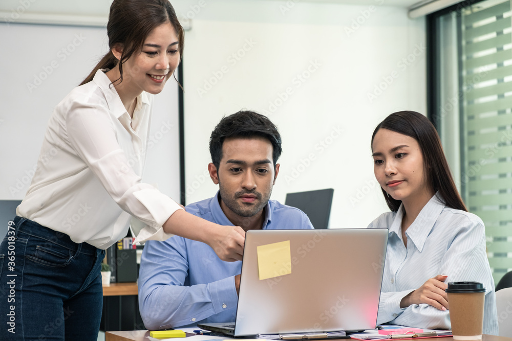Young business group explaining new business ideas to peers. Business people discussing in meeting room. Young business group explaining new business ideas to peers. Business people discussing in meeting room.