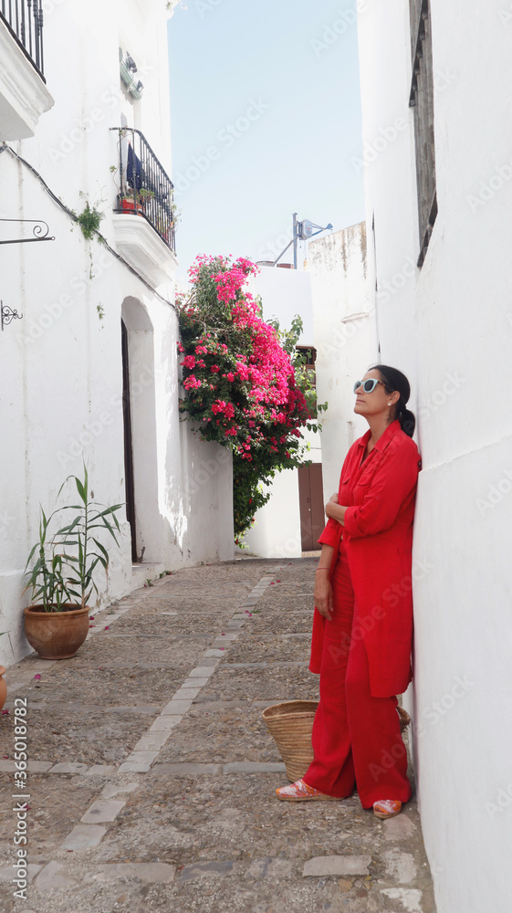mature woman tourist walking and relaxed in Vejer de la Frontera province of Cadiz in Andalusia, Spain