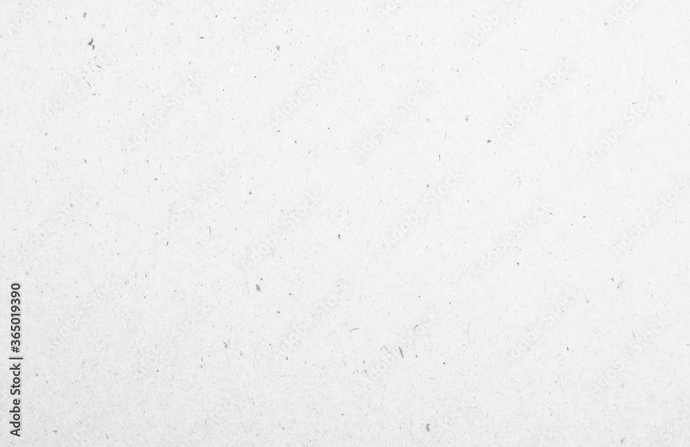 White recycled craft paper texture as background. Grey paper