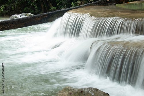 waterfalls in Erawan National Park, a protected area in Kanchanaburi province, Central Thailand, within the Si Sawat district. photo