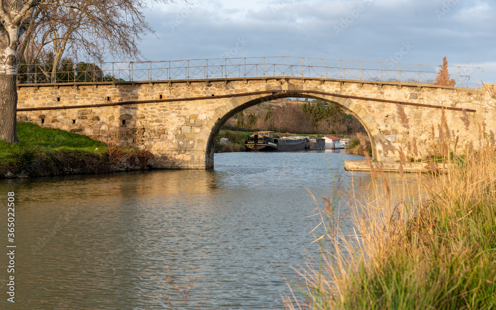 Pretty bridge over the Canal du Midi, France in the village of Roubia