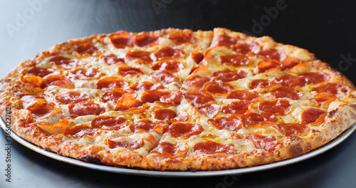 Obraz na plátne large american style pepperoni and cheese pizza