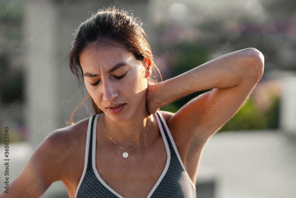 © Stock Rocket - Young Female Athlete Having Neck Problems while exercising © Stock Rocket - Young Female Athlete Having Neck Problems while exercising
