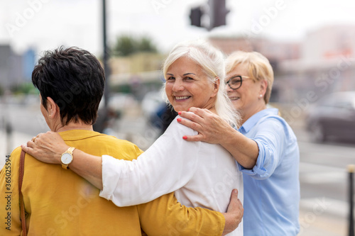 Slika na platnu Three senior female friends having good time together