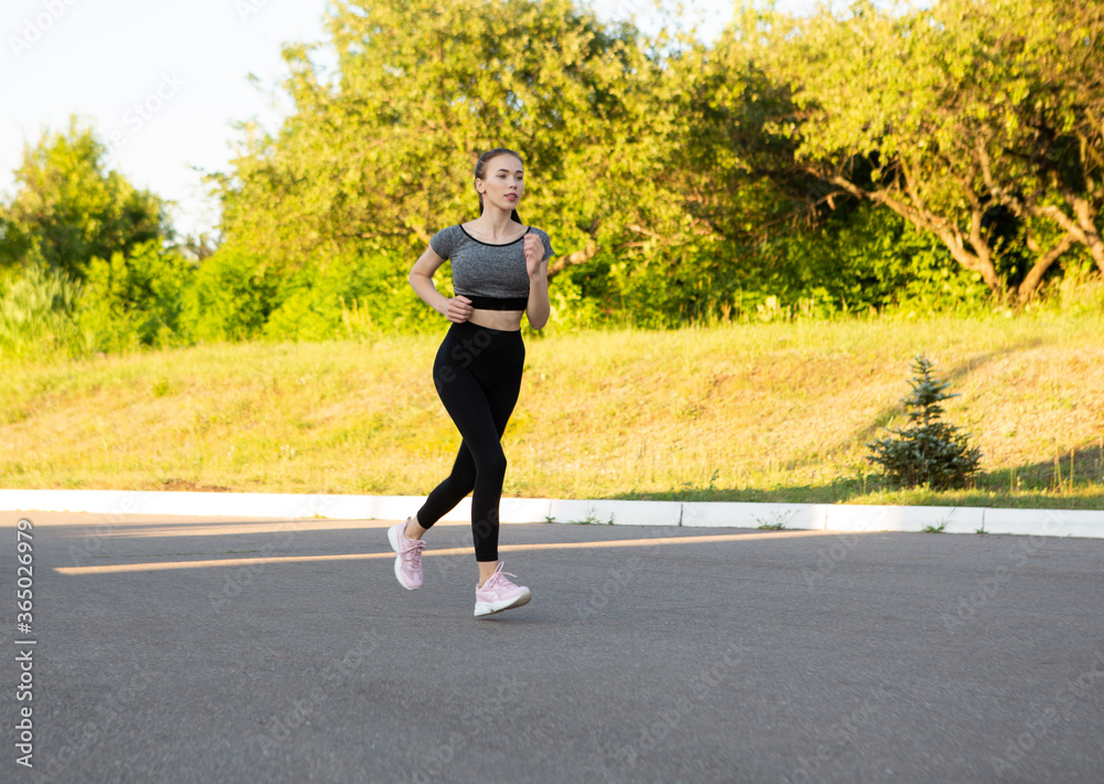 Side view of active sporty young running woman runner. Side view of active sporty young running woman runner.
