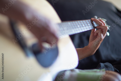 Woman Playing Ccoustic Guitar Abstract.