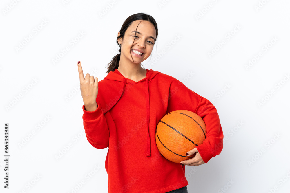 Young woman playing basketball over isolated white background doing coming gesture