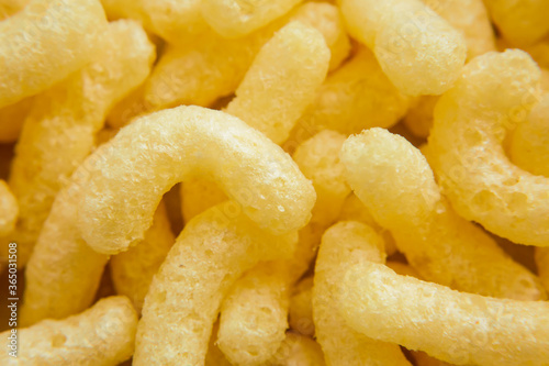 Crispy corn sticks close up, as background or texture.