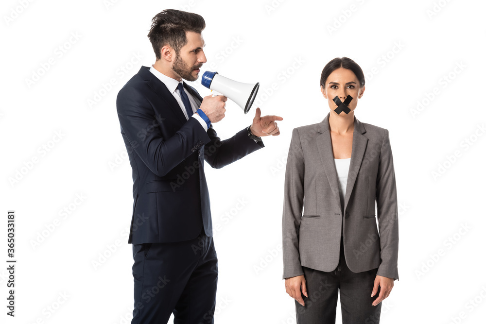 bearded businessman screaming in megaphone and pointing with finger at woman with duct tape on mouth isolated on white bearded businessman screaming in megaphone and pointing with finger at woman with duct tape on mouth isolated on white