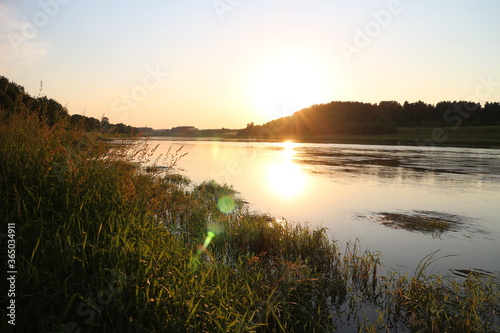 Sunny evening on the river in the countryside