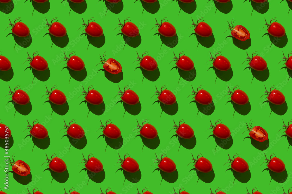 Pattern of Bulgarian sweet peppers, cherry tomatoes and cucumbers on a green background Pattern of Bulgarian sweet peppers, cherry tomatoes and cucumbers on a green background