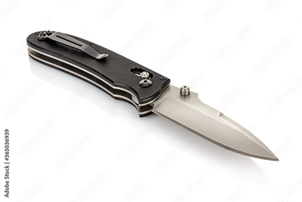 Lying open folding pocket knife with satin blade and black composite plastic cover plates on steel handle isolated on white background with reflection on glossy surface. Pocket knife close-up image Lying open folding pocket knife with satin blade and black composite plastic cover plates on steel handle isolated on white background with reflection on glossy surface. Pocket knife close-up image