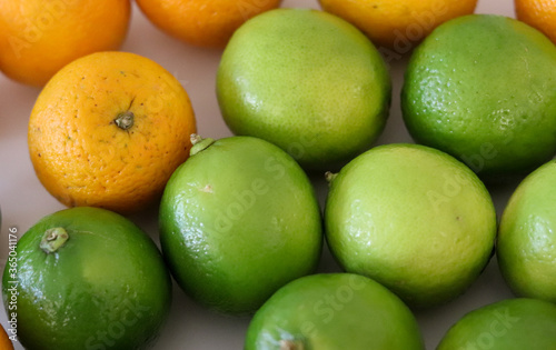 Beautiful lemons and oranges arranged on a table. A fruit rich in vitamin c.