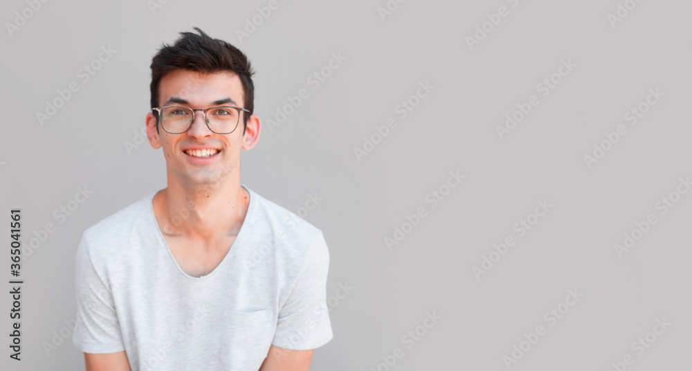 Smiling young man with surprised expression Smiling young man with surprised expression