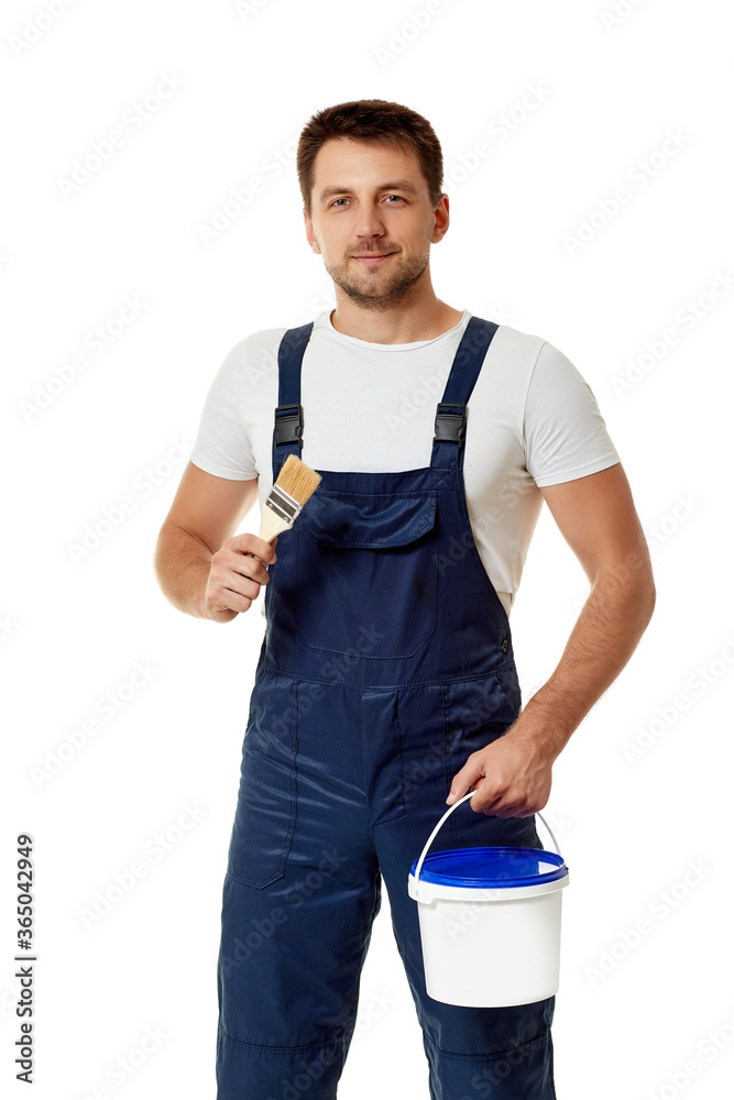caucasian repairman in blue uniform holding paint brush and can with paint. builder or painter decorator isolated on white background caucasian repairman in blue uniform holding paint brush and can with paint. builder or painter decorator isolated on white background