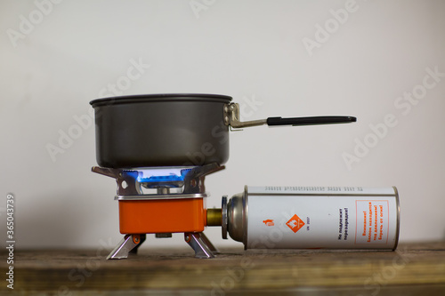 Camping tourist burner and gas cylinder with coffee jezve.
