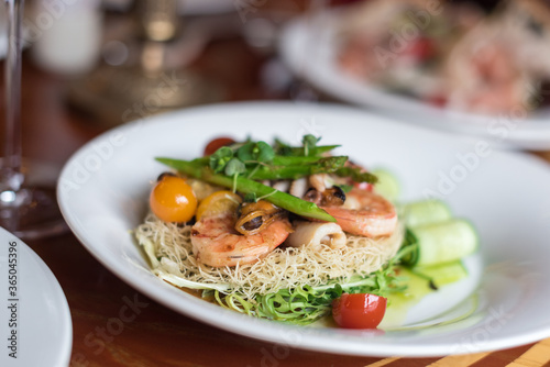 Seafood Crispy Noodles. Asian Crispy Noodles with Prawns, Mussels, Octopus and Fresh Vegetables