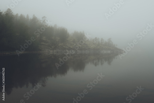 Fog over the lake. Early morning on Ladoga lake in Karelia, Russia.  © Danil Nikonov