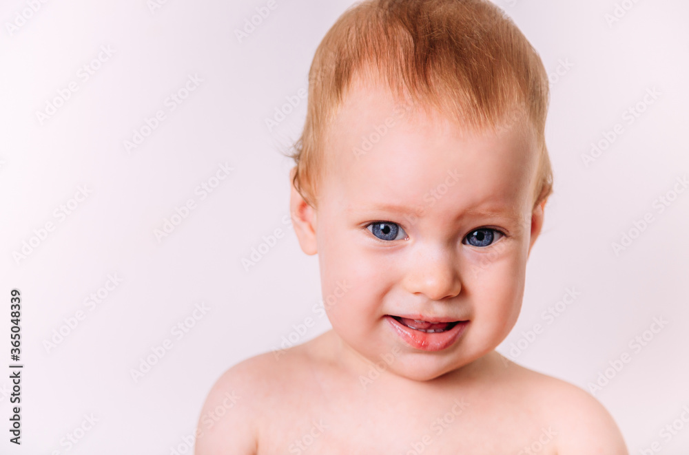 Portrait of a little cute toddler smiling. Isolated on a white background. Portrait of a little cute toddler smiling. Isolated on a white background.