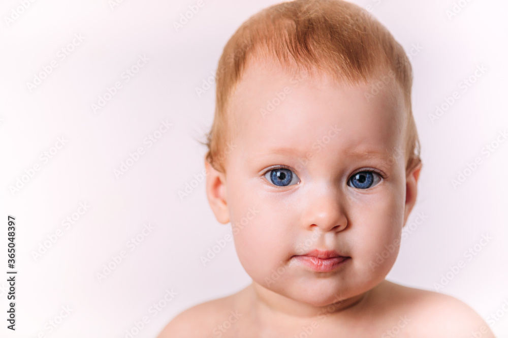 Portrait of a little cute toddler smiling. Isolated on a white background. Portrait of a little cute toddler smiling. Isolated on a white background.