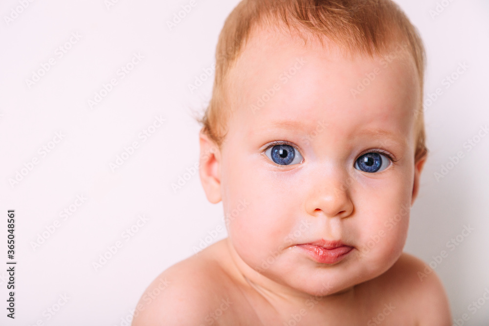 Portrait of a little cute kid looking at the camera. Portrait of a little cute kid looking at the camera.