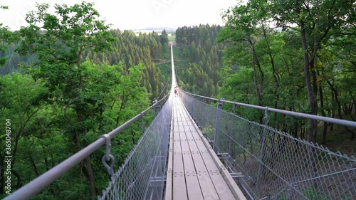 Hiking on a rope bridge photo