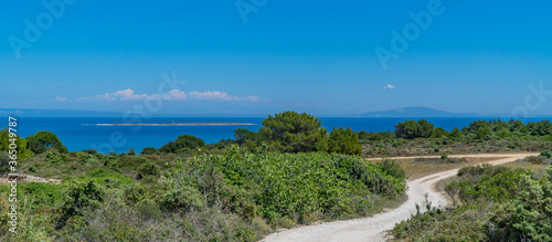 Beautiful panoramic view of Kamenjak National Park, Istria, Croatia with gravel roads, rocky coast lines and islands