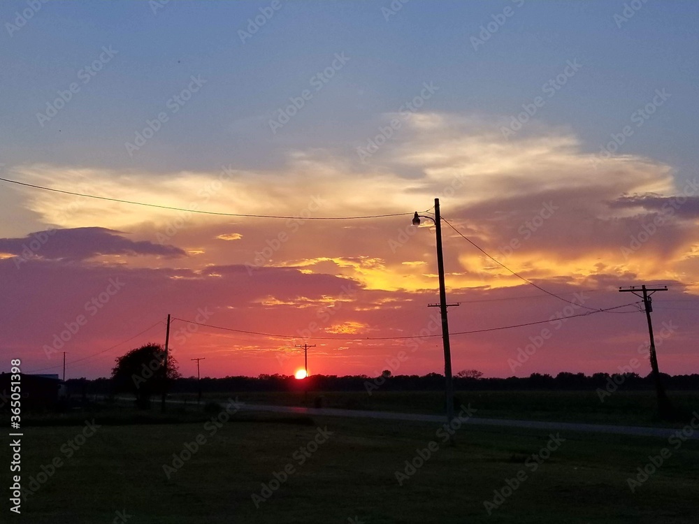 Obraz premium wind turbine at sunset