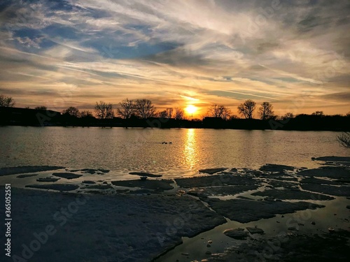 sunset over the frozen lake