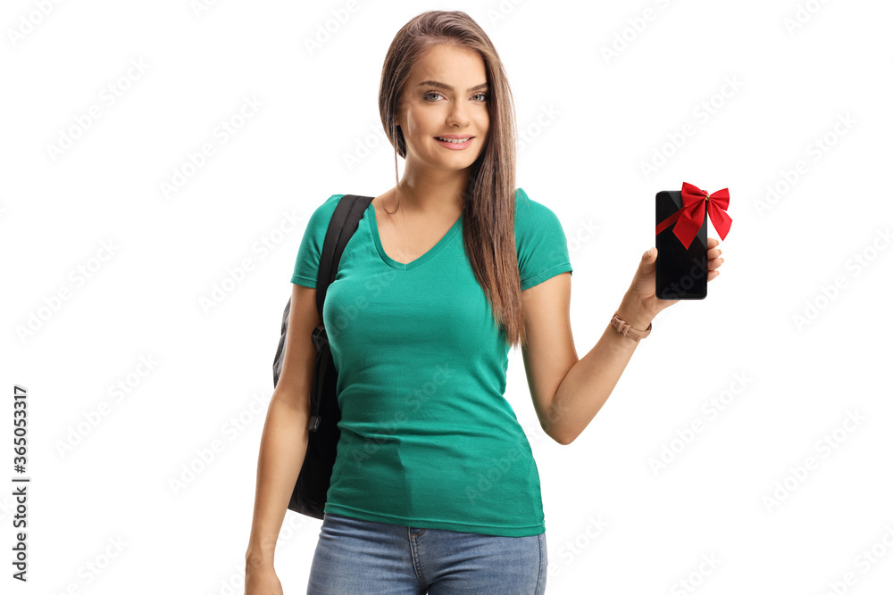 Young woman holding a smartphone with a red bow Young woman holding a smartphone with a red bow