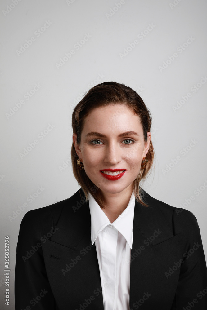 Portrait of business young woman posing over white wall. Confident women concept. Portrait of business young woman posing over white wall. Confident women concept.