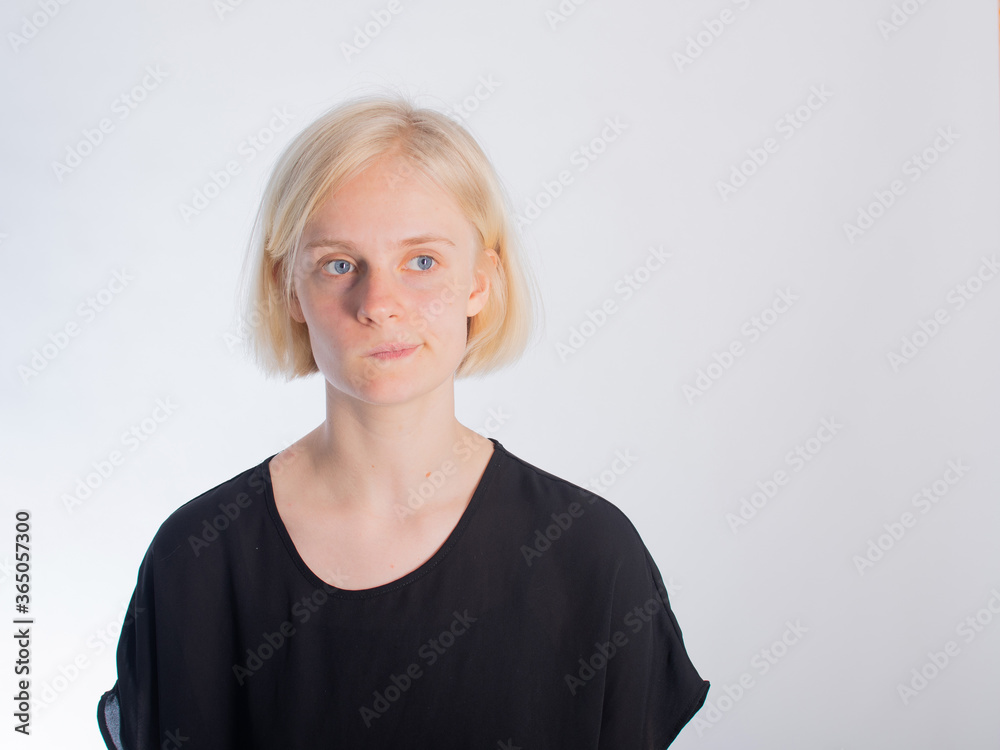 a young girl with her hair all tangled up is grinning. isolate on a white background. space for text a young girl with her hair all tangled up is grinning. isolate on a white background. space for text