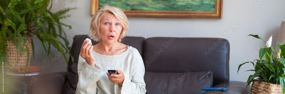 Emotional woman watching TV series. Emotional woman watching TV series.
