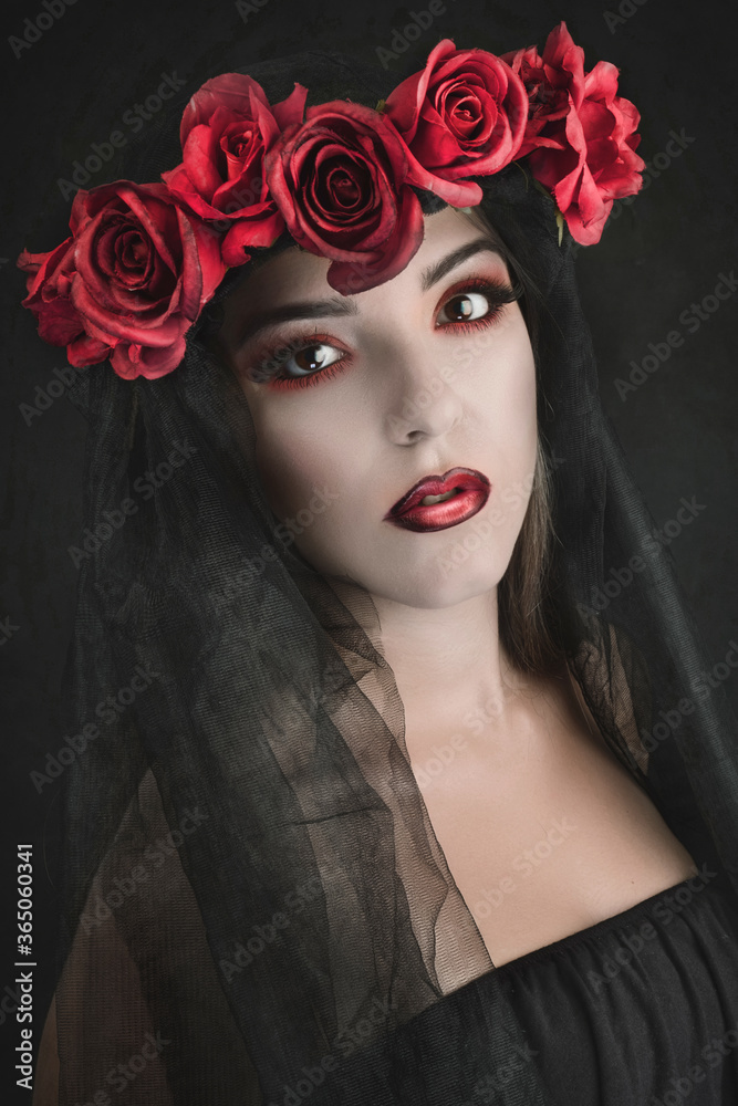 Naklejka premium portrait woman with red flowers and black veil