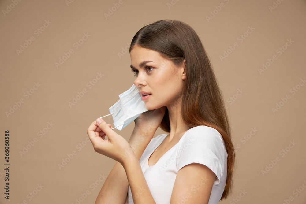 Pretty woman stylish clothes in a protective mask allergy pollution Pretty woman stylish clothes in a protective mask allergy pollution