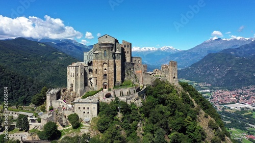 Fotografija The Sacra di San Michele (Saint Michael's) Abbey, Turin, Italy, shot aerial with mountains of Susa valley in background