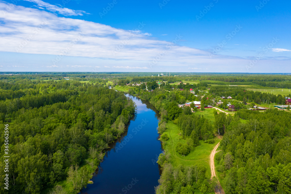The village of Krasnoarmeyskoye, Shuisky district, Ivanovo region on the Teza river on a summer day.