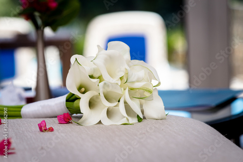 Wedding bridal bouquet made of white calla lily flowers.