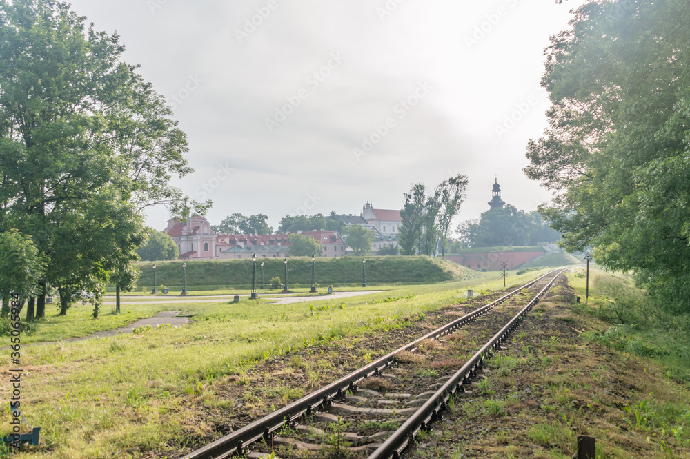 Railway track with old old town of Zamosc in background.