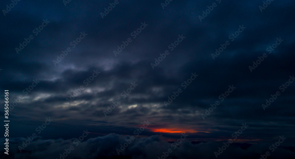 Aerial Sunset Through Clouds