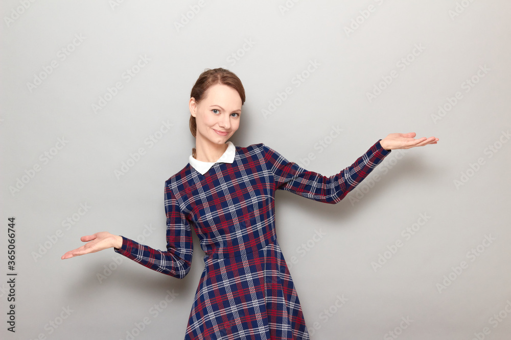 Happy pretty blond girl is pointing with both hands at copy spaces Happy pretty blond girl is pointing with both hands at copy spaces