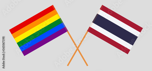 Crossed flags of LGBT and Thailand