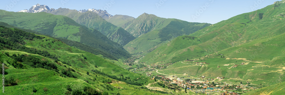 Fototapeta premium Fantastic view of highest mountain village in north ossetia in mountains with cloudy sky. Concept of travel the world