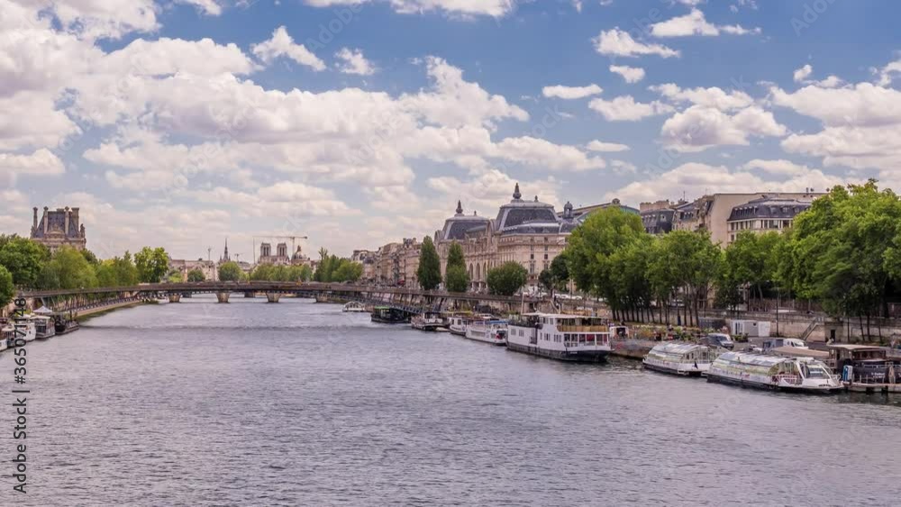 Timelapse of river Seine with fly boats passing by with motion blur ,over hitorical bridge Notre-Dame de Paris is in sight.Sunny cloudy summer day paris famous riverside pan view from right to left Timelapse of river Seine with fly boats passing by with motion blur ,over hitorical bridge Notre-Dame de Paris is in sight.Sunny cloudy summer day paris famous riverside pan view from right to left