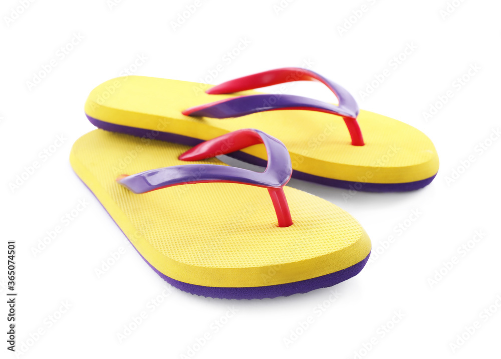 Pair of stylish yellow flip flops isolated on white. Beach object Pair of stylish yellow flip flops isolated on white. Beach object