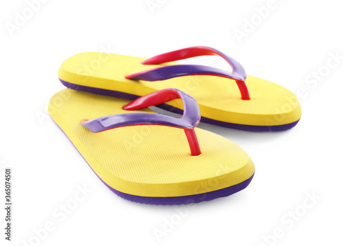 Pair of stylish yellow flip flops isolated on white. Beach object