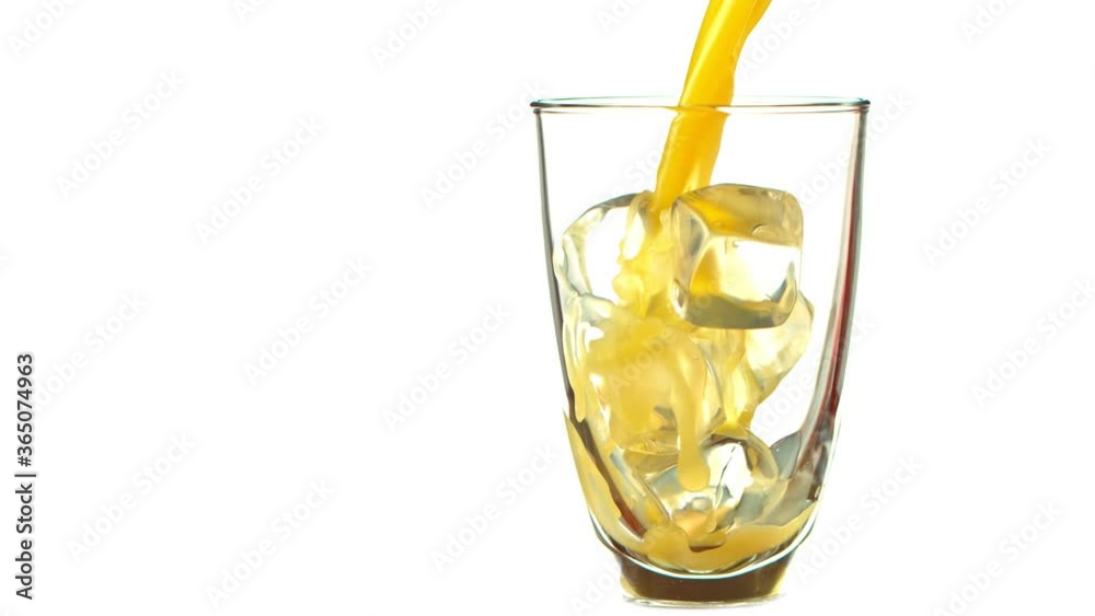 Super Slow Motion Shot of Pouring Fresh Orange Juice into Glass with Ice Cubes at 1000 fps. Super Slow Motion Shot of Pouring Fresh Orange Juice into Glass with Ice Cubes at 1000 fps.