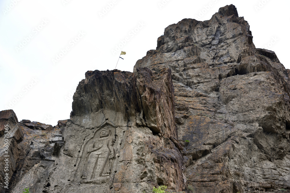 Buddha at Kargah Gilgit, Manthal Rock in the mountain range in Gilgit-Baltistan, Northern Area, Kashmir, Pakistan. 