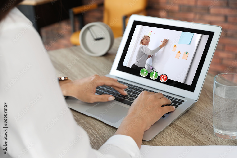 Fototapeta premium Distance learning, online school lesson. Girl studying at home during quarantine and lockdown due to Covid-19 pandemic, closeup