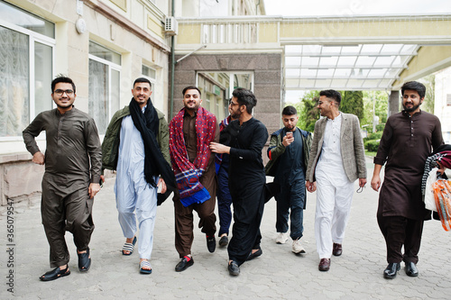 Group of pakistani man wearing traditional clothes salwar kameez or kurta.